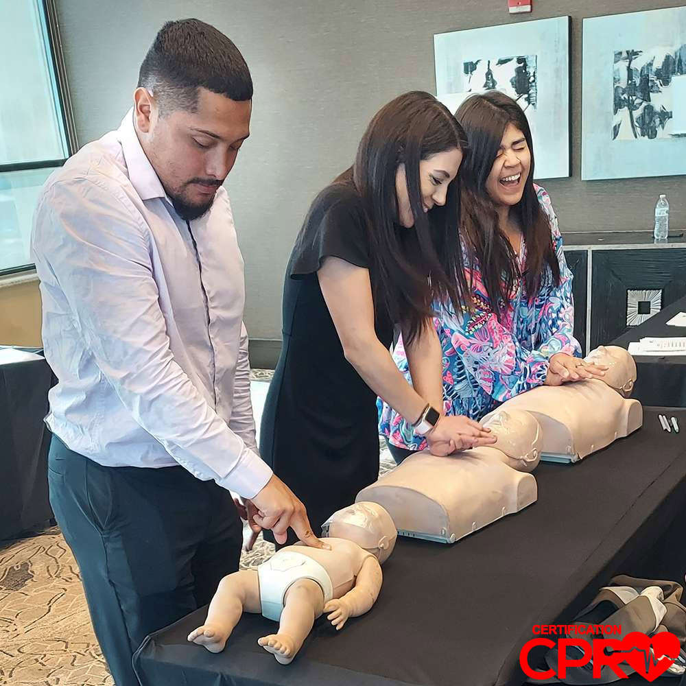 CPR training class in Fort Worth with students practicing on mannequins.
